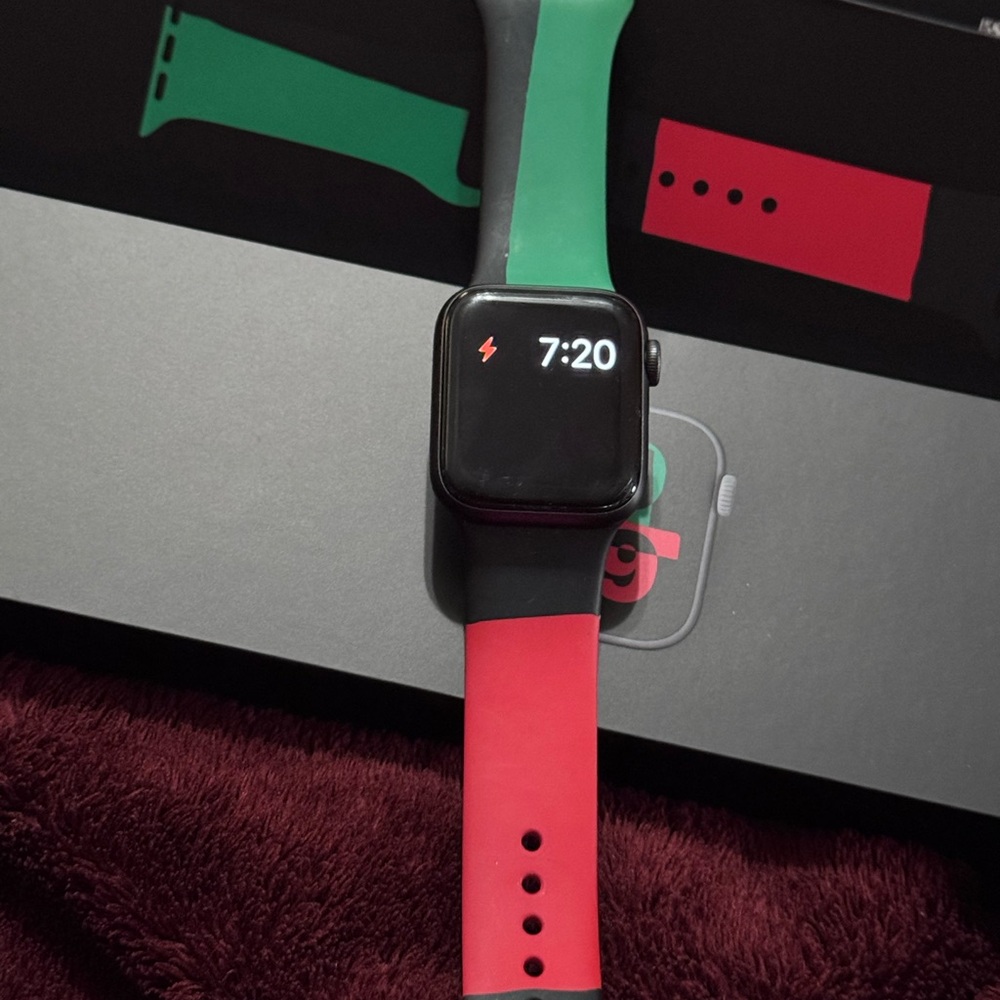 Apple Smartwatch with Black, Green, and Red Strap